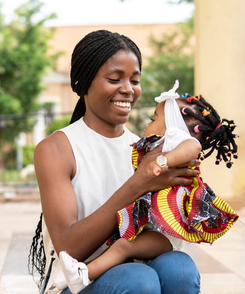 medium shot woman holding little girl 1